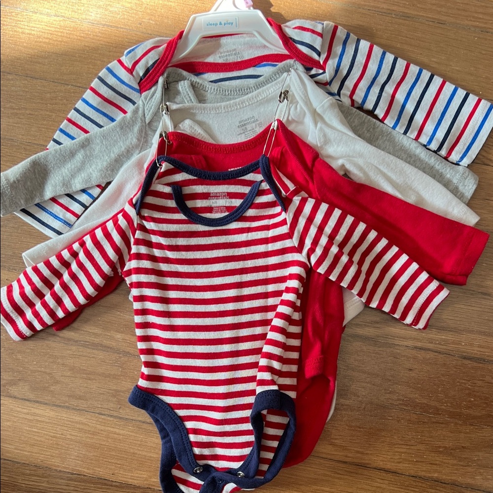 Like new Amazon Essentials set of 5 long sleeve onesies, newborn size